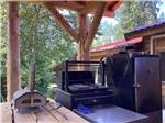 The BBQ area with a pizza oven at THE HEMLOCKS RV AND LODGING - thumbnail