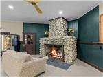A large stone fireplace in the rec hall - thumbnail