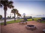 View of bbq pit, fire pit and bench at STELLA MARE RV RESORT - thumbnail
