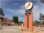 View larger image of Orange white and black sign with horse on it at CRAZY HORSE RV RESORT image #1
