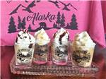 Ice cream sundaes in cups with the park name at RANCH HOUSE LODGE & RV CAMPING - thumbnail
