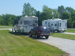 Travel trailers in gravel sites at Camp Mi Casa on the Route RV Park - thumbnail
