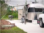 View larger image of RVs parked next to the pond at KEYSTONE HEIGHTS RV RESORT image #3