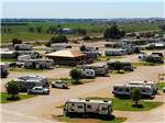 View larger image of RVs parked in gravel sites off gravel road at BUDS PLACE RV PARK  CABINS image #1