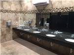 View larger image of Clean restroom with 5 sinks at BUDS PLACE RV PARK  CABINS image #3