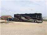 View larger image of RV parked at gravel campsite at BUDS PLACE RV PARK  CABINS image #4