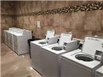 View larger image of Laundry room with 4 washers and dryers at BUDS PLACE RV PARK  CABINS image #5