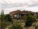 Exterior of cabin in rocky landscape with hills in the background Escalante Grand Resort - thumbnail