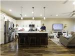 View larger image of Two people in the modern kitchen at RETAMA VILLAGE image #2