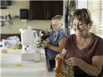 View larger image of A couple of women sewing at RETAMA VILLAGE image #5