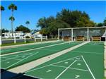 View larger image of A row of shuffleboard courts at BLUEBONNET RV RESORT image #5