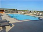 View larger image of Swimming pool at lodge at WHISTLE STOP RV RESORT image #9