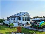 A golf cart parked at a rental at Deep Creek RV Resort & Campground - thumbnail