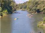 View larger image of People floating on the river at HIDDEN SPRINGS RV RESORT image #3