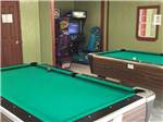 View larger image of Pool tables with arcade games in background at HIDDEN SPRINGS RV RESORT image #11