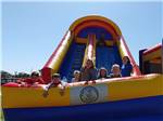 Children playing on inflatable slide at NMB RV RESORT AND DRY DOCK MARINA - thumbnail