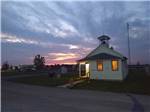 View larger image of View of main office at dusk at LIGHTHOUSE LANDING RV PARK  CABINS image #1