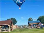 Hot air balloon floating over the park at Springerville RV Park - thumbnail