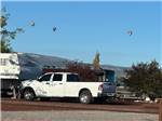 White truck in a site at Springerville RV Park - thumbnail