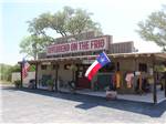 View larger image of The general store with flags at RIVERBEND ON THE FRIO image #1
