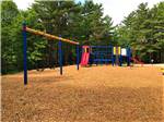 The children's playground equipment at MANISTIQUE LAKESHORE CAMPGROUND - thumbnail