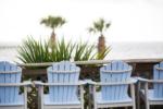 Seating area with water view at Gulf Beach RV Resort - thumbnail