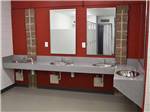 View larger image of Clean bathroom with stainless-steel sinks at BEAR PAW PAR 3 GOLF COURSE  RV PARK image #8