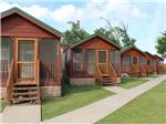 A row of rental cabins at BAYOU BEND RV RESORT - thumbnail
