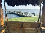View of the pier from a rustic swing - thumbnail