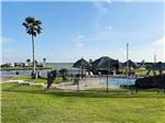 The gated pool with RVs in the background - thumbnail
