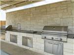 The barbeque area with sinks at JETSTREAM RV RESORT - TROPICAL TRAILS - thumbnail