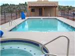 View larger image of The swimming pool and hot tub at RAIN SPIRIT RV RESORT image #4