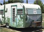 A painted travel trailer at OAKDALE PARK - thumbnail