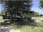 A fifth wheel trailer in an RV site at OAKDALE PARK - thumbnail