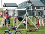 View larger image of Kids at playground at RIVERSIDE CAMPING  RV RESORT image #6