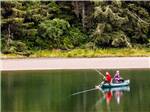 View larger image of Campers fishing on the lake at PACIFIC CITY RV CAMPING RESORT image #3