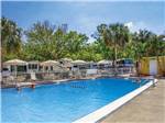 View larger image of Swimming pool with outdoor seating at VACATION VILLAGE RV RESORT image #4