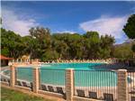 View larger image of Swimming pool with outdoor seating at SOLEDAD CANYON RV  CAMPING RESORT image #2