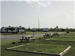 Tent sites with a picnic bench at LAKE CHARLES RV RESORT BY RJOURNEY - thumbnail