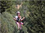 A lady and her daughter ziplining - thumbnail