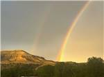 A rainbow behind the mountain nearby - thumbnail