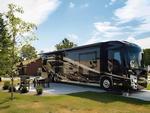 A motorhome in a paved site at - thumbnail