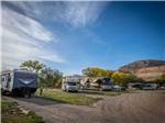 RVs parked at campground sites at PALISADE BASECAMP RV RESORT - thumbnail