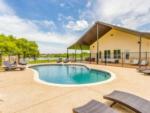 The small kidney-shaped pool at TEXAS RANCH RV RESORT - thumbnail