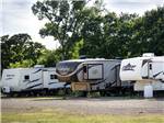 A row of travel trailers at HIDDEN LAKE RV RANCH & SAFARI - thumbnail