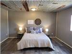 A view of the bedroom in the cabin at HIDDEN LAKE RV RANCH & SAFARI - thumbnail