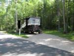 Parked RV at site Torch Lake Campground & RV Park - thumbnail