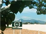 Park sign and distant mountains at ASPEN GROVE RV PARK - thumbnail