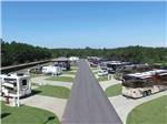 Brown, white and tan motorhomes parked at RV site at WIND CREEK ATMORE CASINO RV PARK - thumbnail