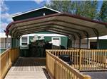 View larger image of Covered deck outside of main building at HOLLY ACRES CAMPGROUND image #4